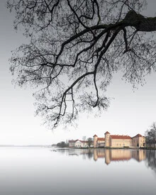 Photo art by Ronny Behnert: Schloss Rheinsberg in fog over a tranquil lake