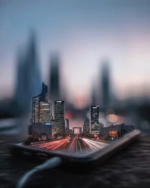 Photo art by Georges Amazo: long exposure cityscape featuring a phone