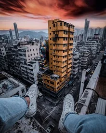 Photo art by Georges Amazo: cityscape with shoes on a rooftop in Hong Kong.