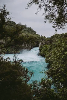 Photo art by Jessica Wiedemann: tranquil waterfall in New Zealand with turquoise water