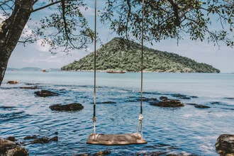 Photo art by Jessica Wiedemann: swing on an island with ocean in the background