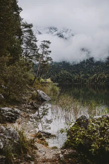 Photo art by Jessica Wiedemann: serene mountain lake reflecting surrounding trees