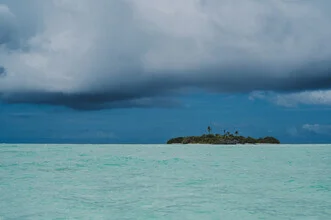 Photo art by Jessica Wiedemann: stormy island with blue ocean tones