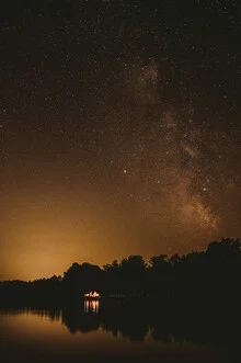 Photo art by Jessica Wiedemann: Night sky filled with stars over a calm lake