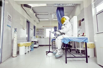 Photo art by Sophia Hauk: Protestonaut in a hospital conveying a sense of concern.