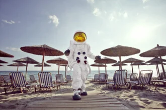 Photo art by Sophia Hauk: a protest astronaut enjoying the beach under umbrellas