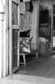 Photo art by Charlotte McGinnis: relaxed siesta in Mumbai with newspaper and book