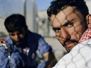 Portrait of a worker in Dubai, featuring warm colors and a relaxed atmosphere.