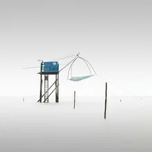 Photo art by Ronny Behnert: calm scene with a fisher hut and fog over the sea