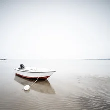 Photo art by Dennis Wehrmann: boat on calm water at sunset