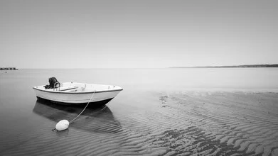 Photo art by Dennis Wehrmann: calm boat on water at sunset