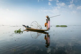 Photo art by Ulrich Wolf: Fisherman on a tranquil lake in Myanmar