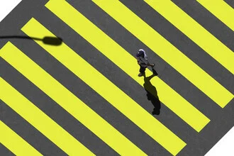 Photo art by Pascal Krumm: urban scene with a zebra crossing and a man in shadows.