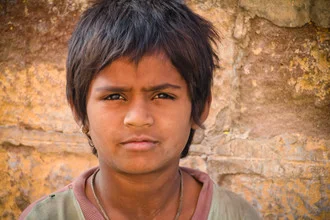 Portrait of a boy from Jodhpur with a blue city backdrop