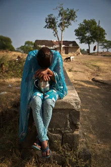 Shy girl in traditional clothing in Rajasthan, India.