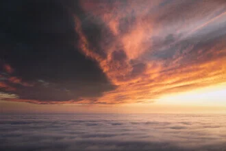 Beautiful evening sky with vibrant colors and gentle fog swirls.