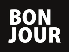 Wall art featuring a positive message: 'Bonjour' in white on a black background.