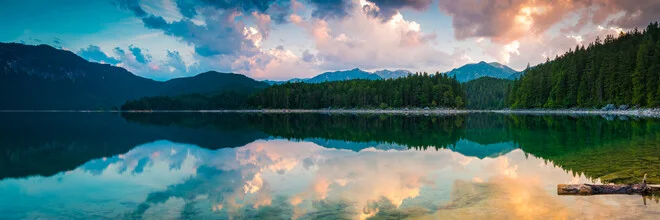 Photo art by Martin Wasilewski: gentle sunrise over Lake Eibsee and mountains